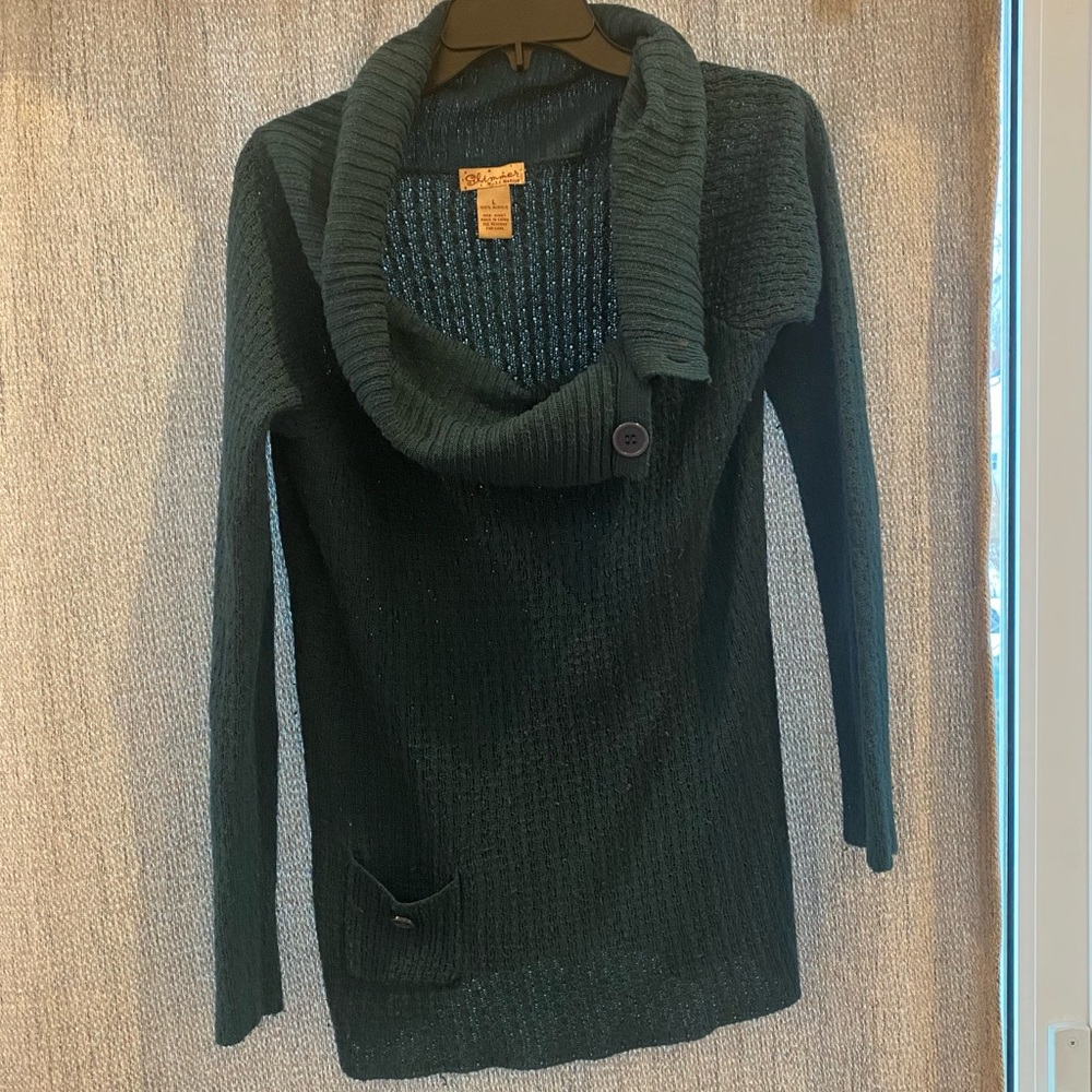 Aqua sweater with button on right top.  Large
